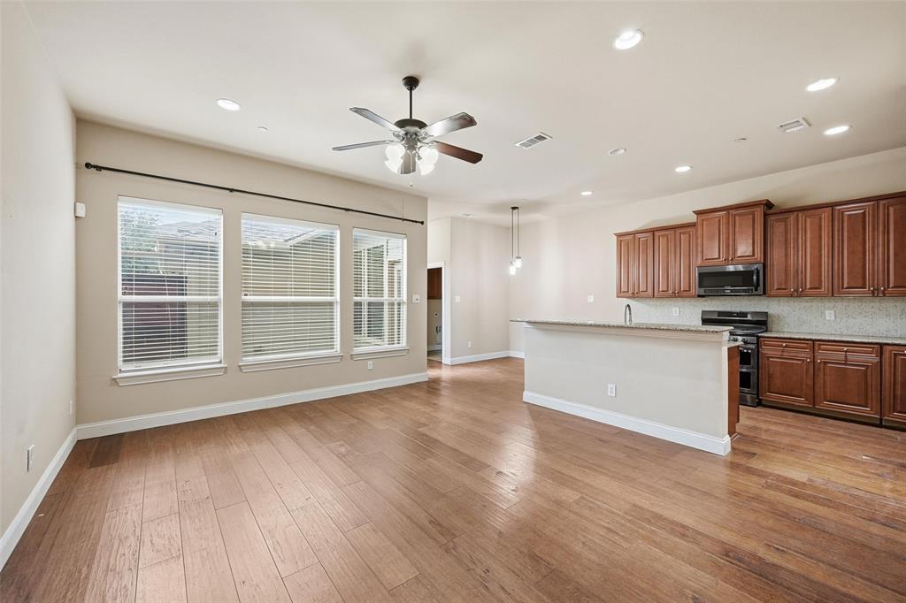 4673 Cecile Road Plano, TX 75024 - Photo 13 of 29 a view of kitchen with granite countertop cabinets and wooden floor