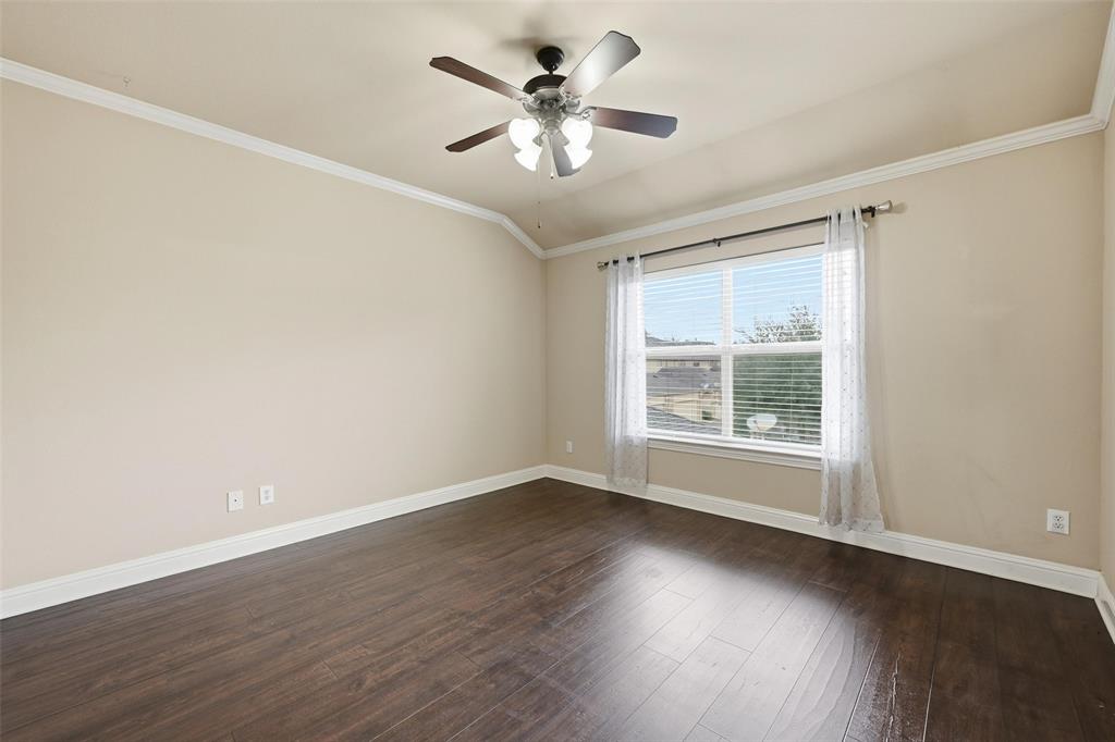 4673 Cecile Road Plano, TX 75024 - Photo 18 of 29 an empty room with wooden floor and windows
