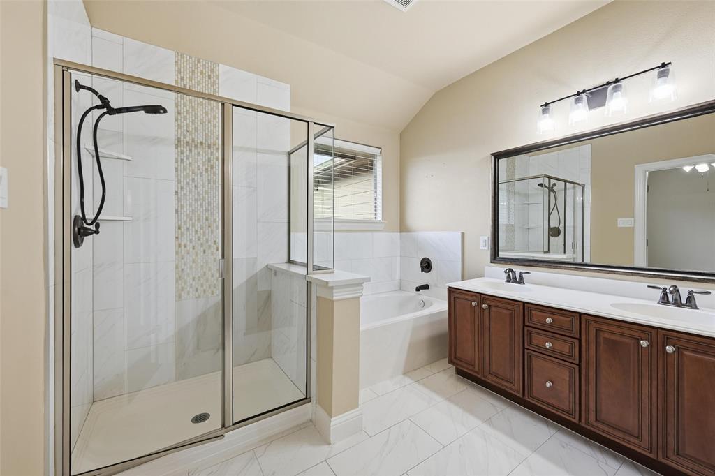 4673 Cecile Road Plano, TX 75024 - Photo 21 of 29 a bathroom with a double vanity sink mirror and shower