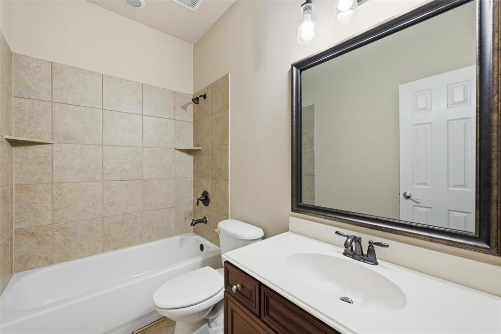 4673 Cecile Road Plano, TX 75024 - Photo 23 of 29 a bathroom with a sink a toilet and a bathtub