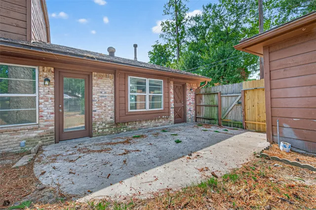 a view of a house with a backyard and balcony