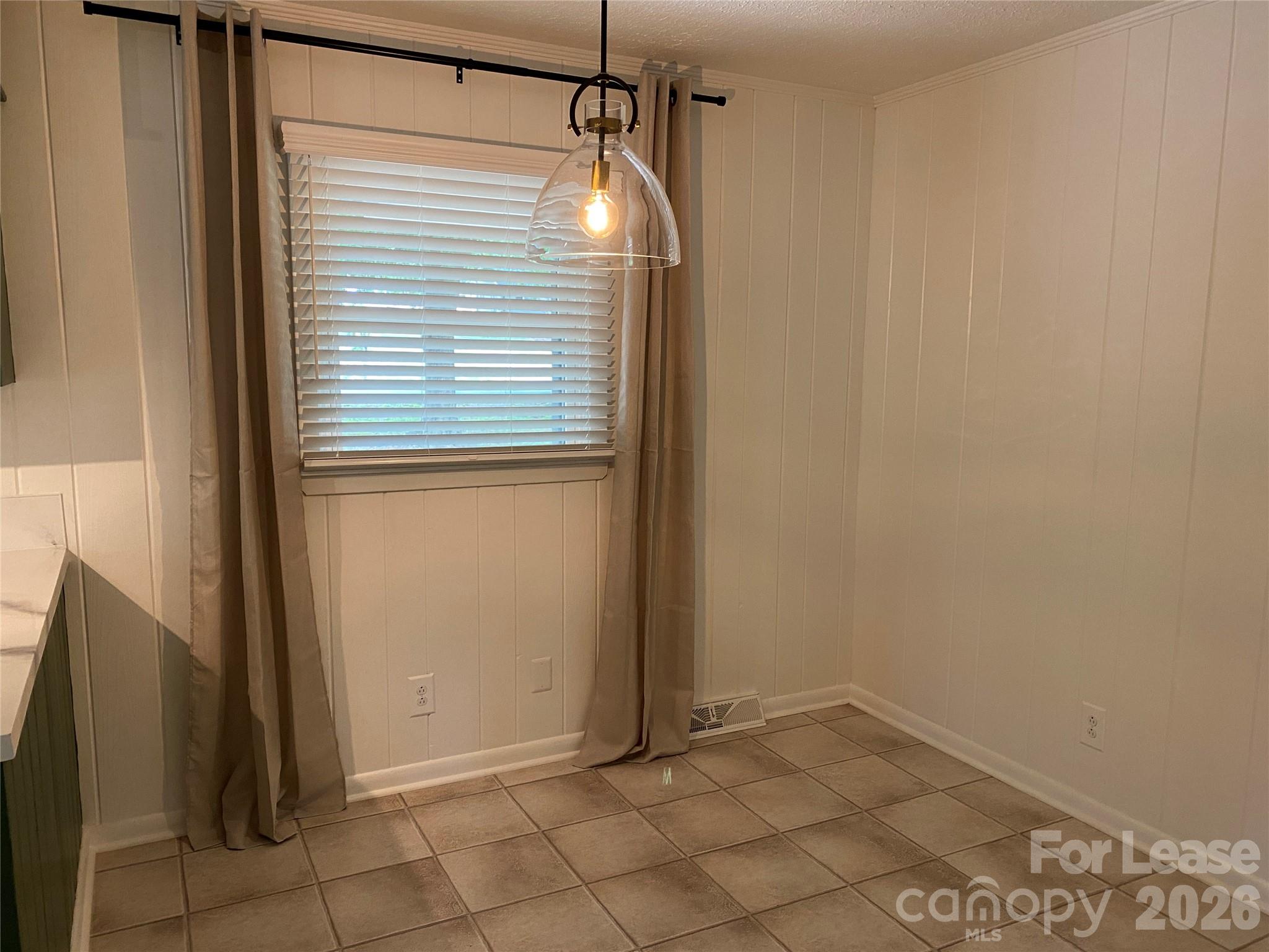 210 Park Road Mount Holly, NC 28120 - Photo 4 of 12 a view of empty room with window
