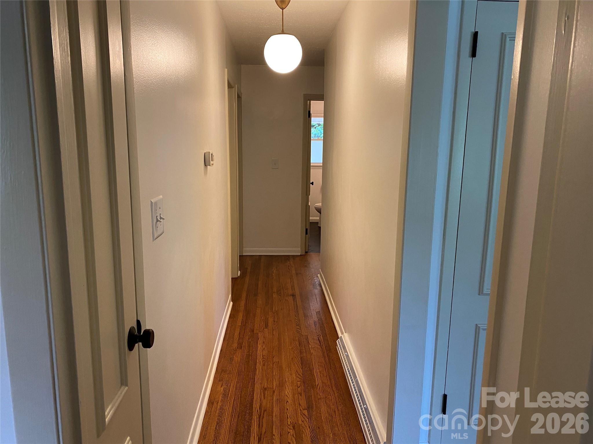 210 Park Road Mount Holly, NC 28120 - Photo 5 of 12 a view of a hallway with wooden floor