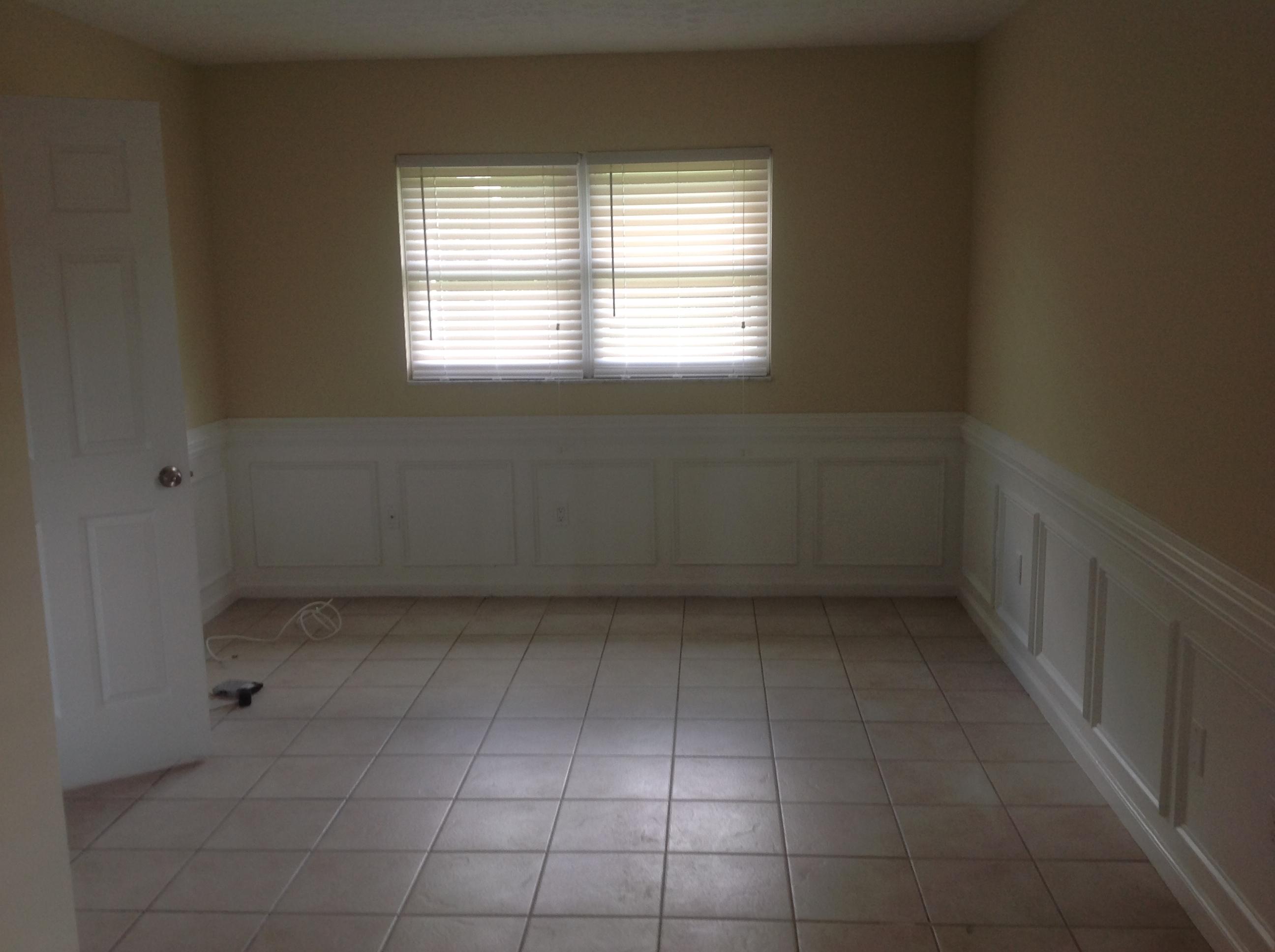 1545 Southeast Pitcher Road Port St. Lucie, FL 34952 - Photo 9 of 22 an empty room with a window