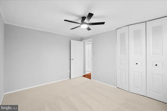 a view of a livingroom with a ceiling fan and a ceiling fan