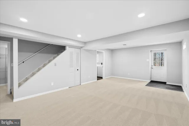 a view of washer and dryer with wooden floor