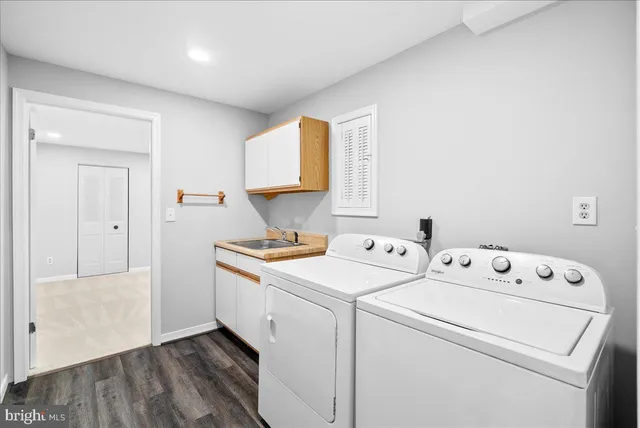 a view of deck and space with wooden floor and fence