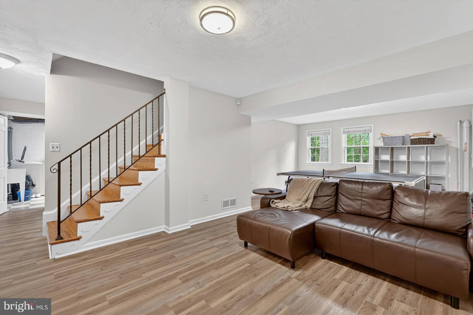 500 Finsbury Road Silver Spring, MD 20904 - Photo 33 of 54 a living room with furniture and stairs