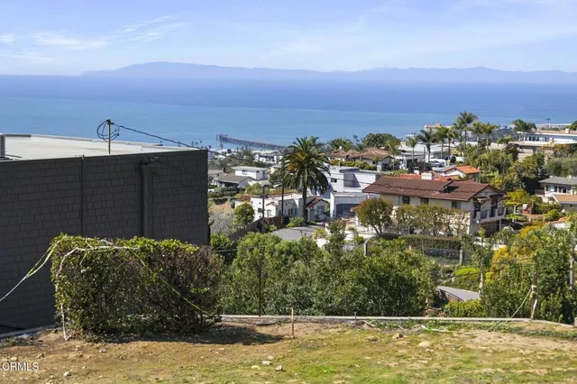a view of a lake with a building in the background
