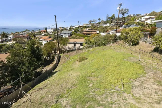 a view of a swimming pool with a yard