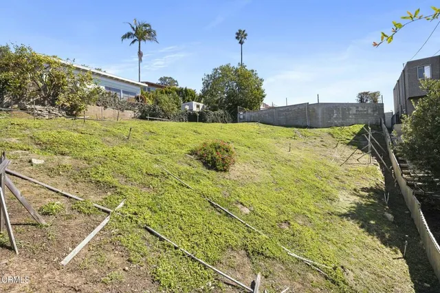 an aerial view of residential building and trees around