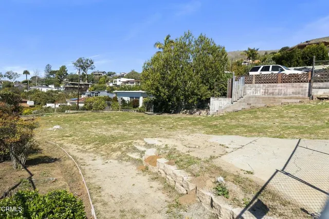 a view of a swimming pool with a yard