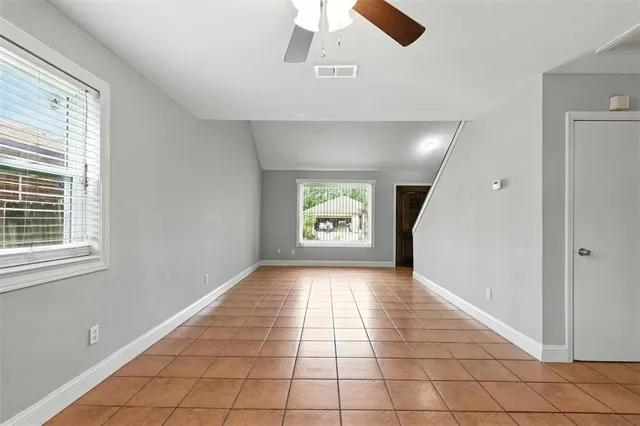 a view of an empty room and window