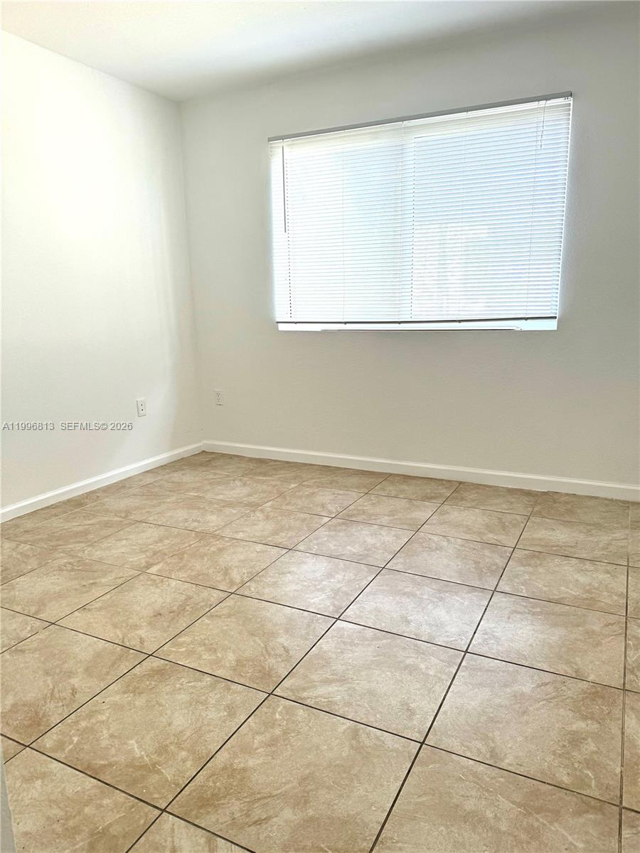 15480 Southwest 284th Street, Unit 2307 Homestead, FL 33033 - Photo 11 of 19 an empty room with a window