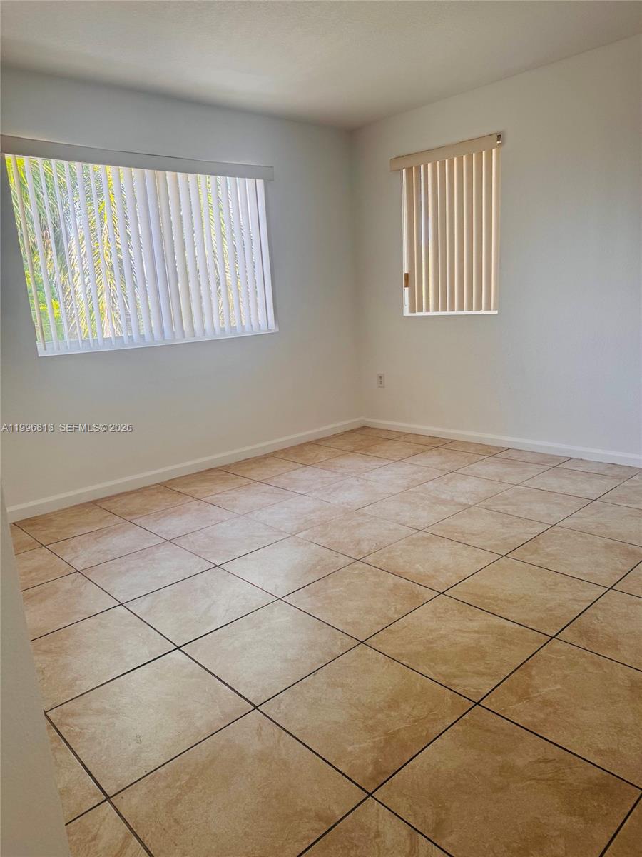 15480 Southwest 284th Street, Unit 2307 Homestead, FL 33033 - Photo 13 of 19 a view of an empty room with a window