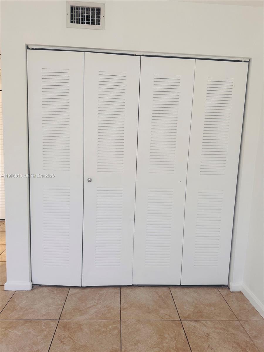15480 Southwest 284th Street, Unit 2307 Homestead, FL 33033 - Photo 14 of 19 a view of a white door and a window