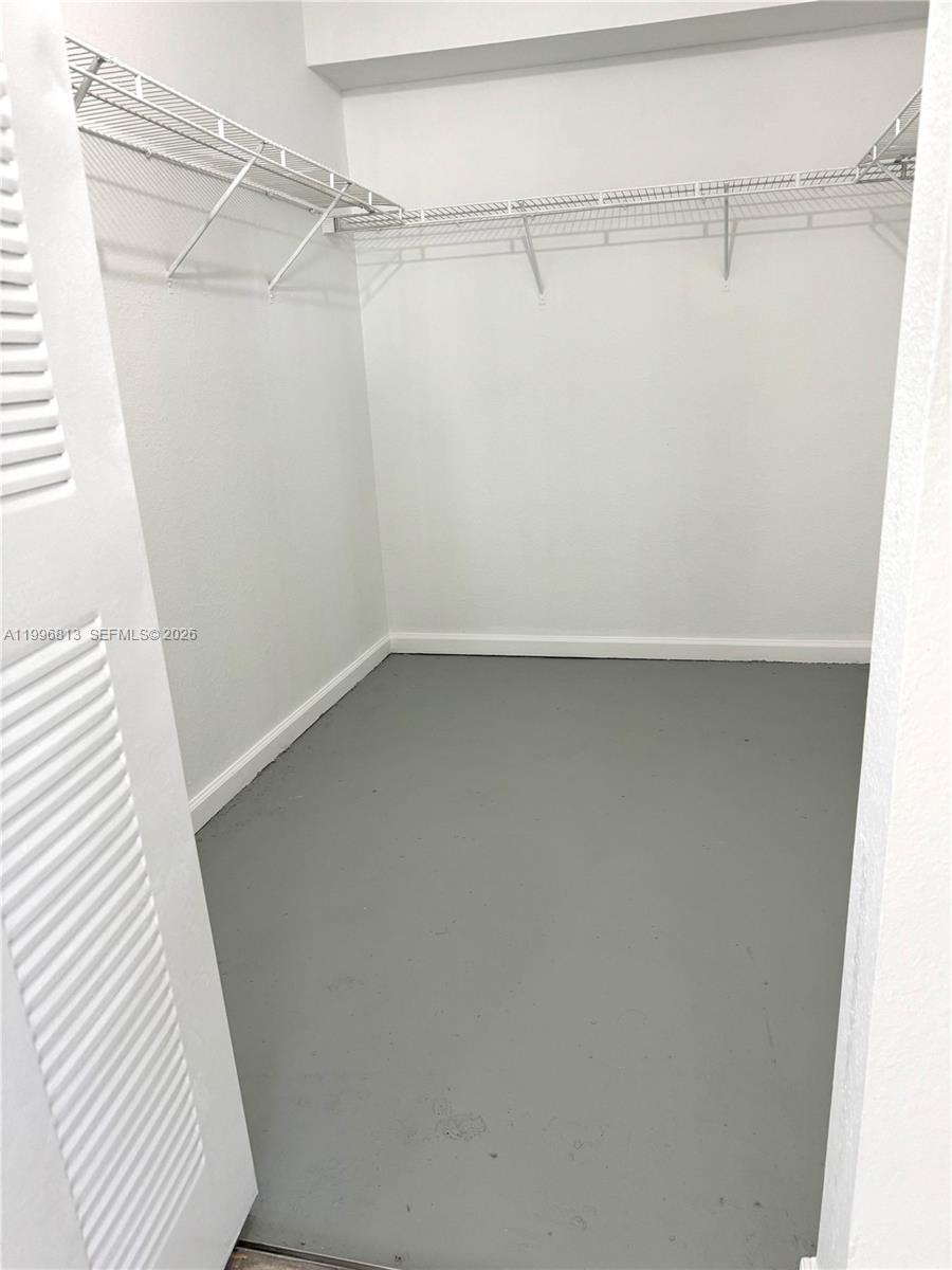 15480 Southwest 284th Street, Unit 2307 Homestead, FL 33033 - Photo 15 of 19 a view of a room with racks on the wall