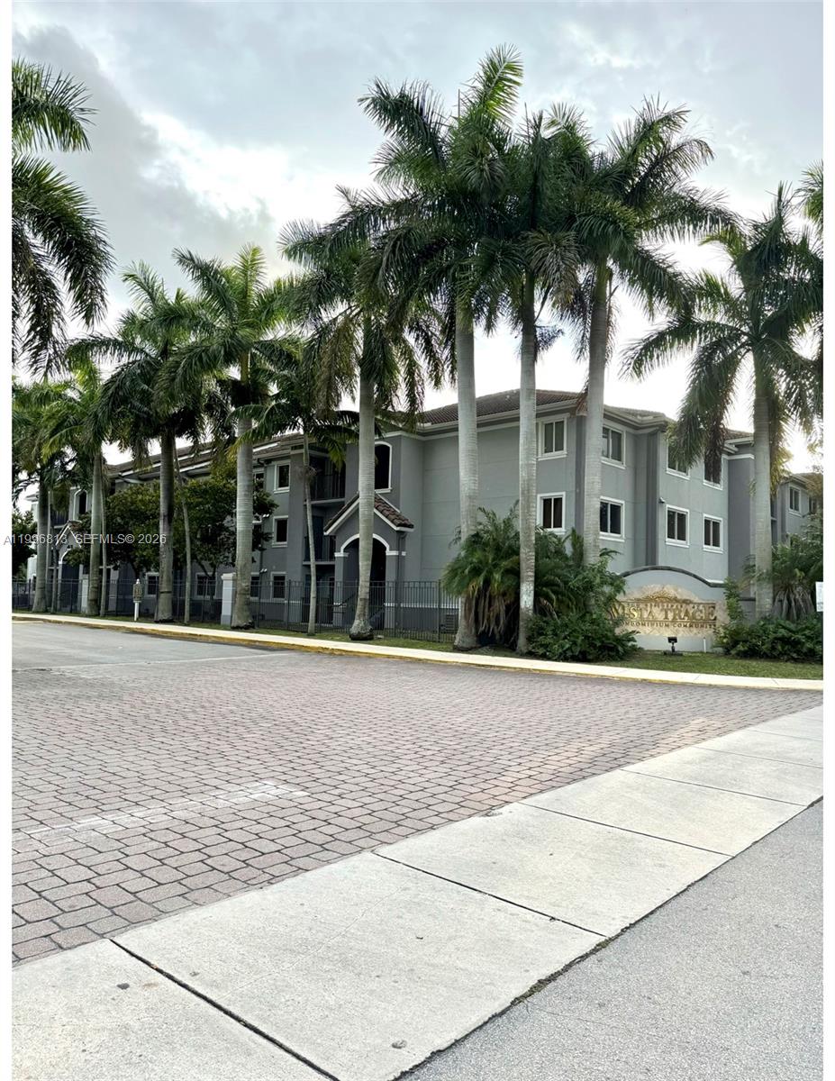 15480 Southwest 284th Street, Unit 2307 Homestead, FL 33033 - Photo 17 of 19 front view of house with palm trees