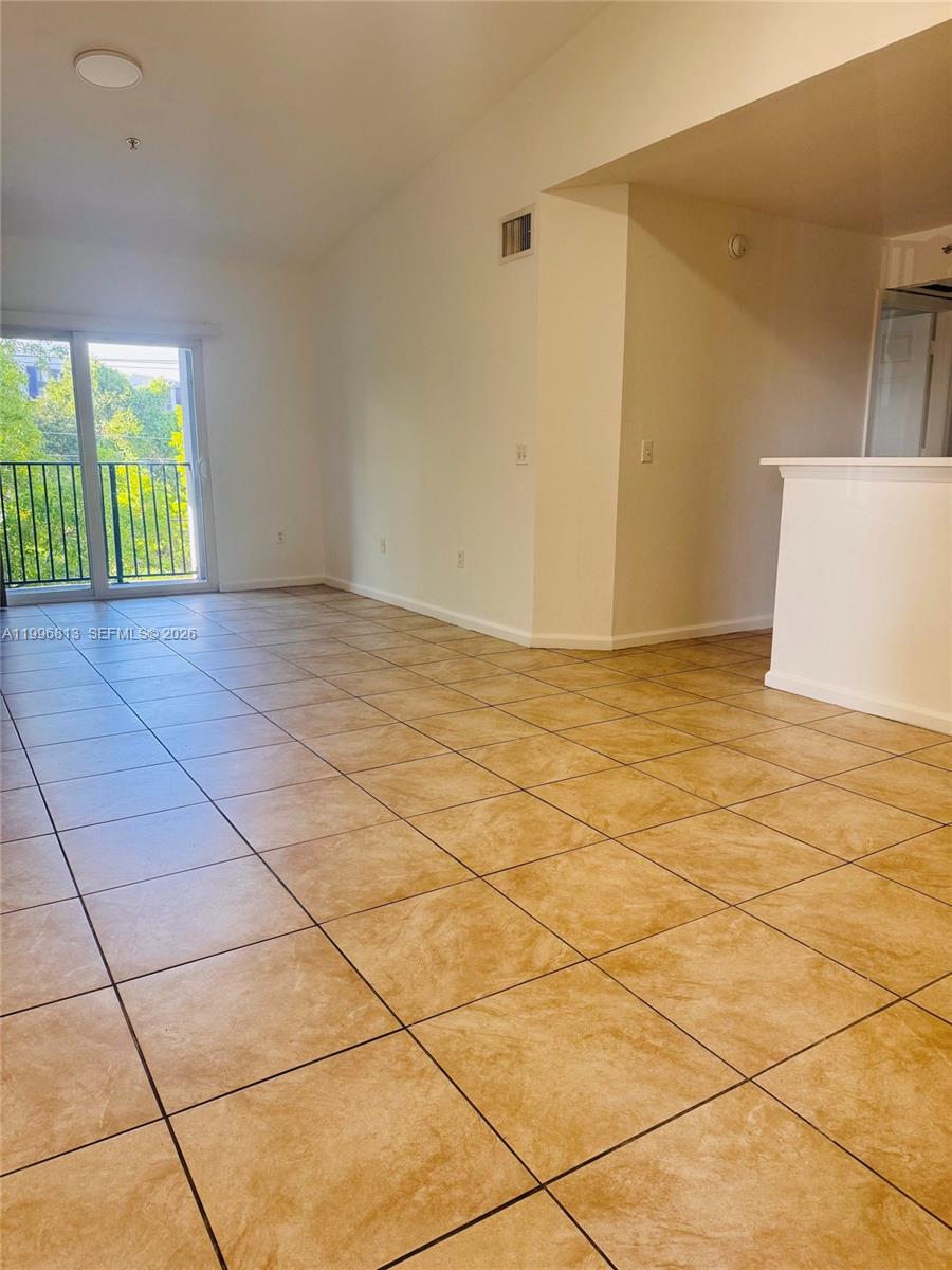 15480 Southwest 284th Street, Unit 2307 Homestead, FL 33033 - Photo 5 of 19 a view of an empty room and window
