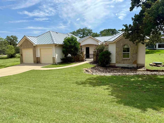 front view of a house with a yard