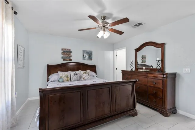 a bedroom with a bed and a dresser