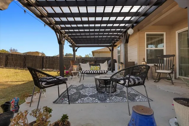 a roof deck with a table and chairs