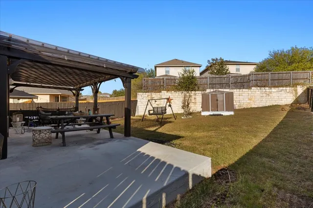 a view of a swimming pool with outdoor seating