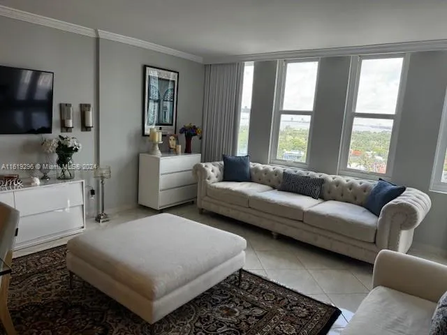 a living room with furniture and a rug