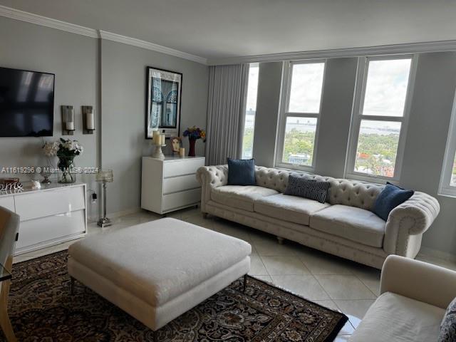 5401 Collins Avenue, Unit 1123 Miami Beach, FL 33140 - Photo 17 of 38 a living room with furniture and a flat screen tv