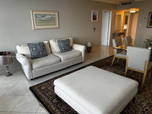 5401 Collins Avenue, Unit 1123 Miami Beach, FL 33140 - Photo 18 of 38 a living room with furniture and a rug