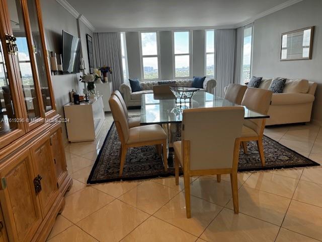 5401 Collins Avenue, Unit 1123 Miami Beach, FL 33140 - Photo 22 of 38 a living room with furniture and a flat screen tv