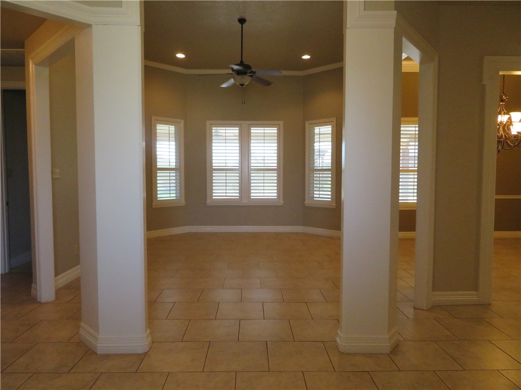 5803 South Oso Parkway Corpus Christi, TX 78414 - Photo 3 of 39 a view of a hallway with windows and chandelier