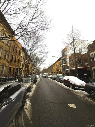a view of a street with cars