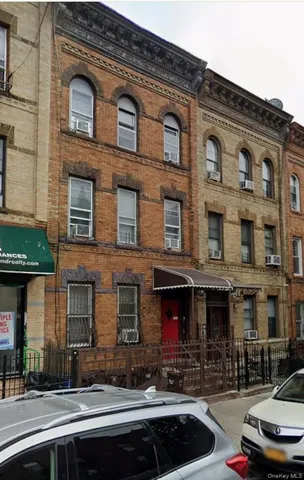 a front view of a building with street view