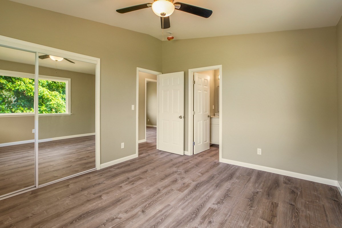 4722 Mailihuna Road Kapaa, HI 96746 - Photo 11 of 22 wooden floor in an empty room with a window