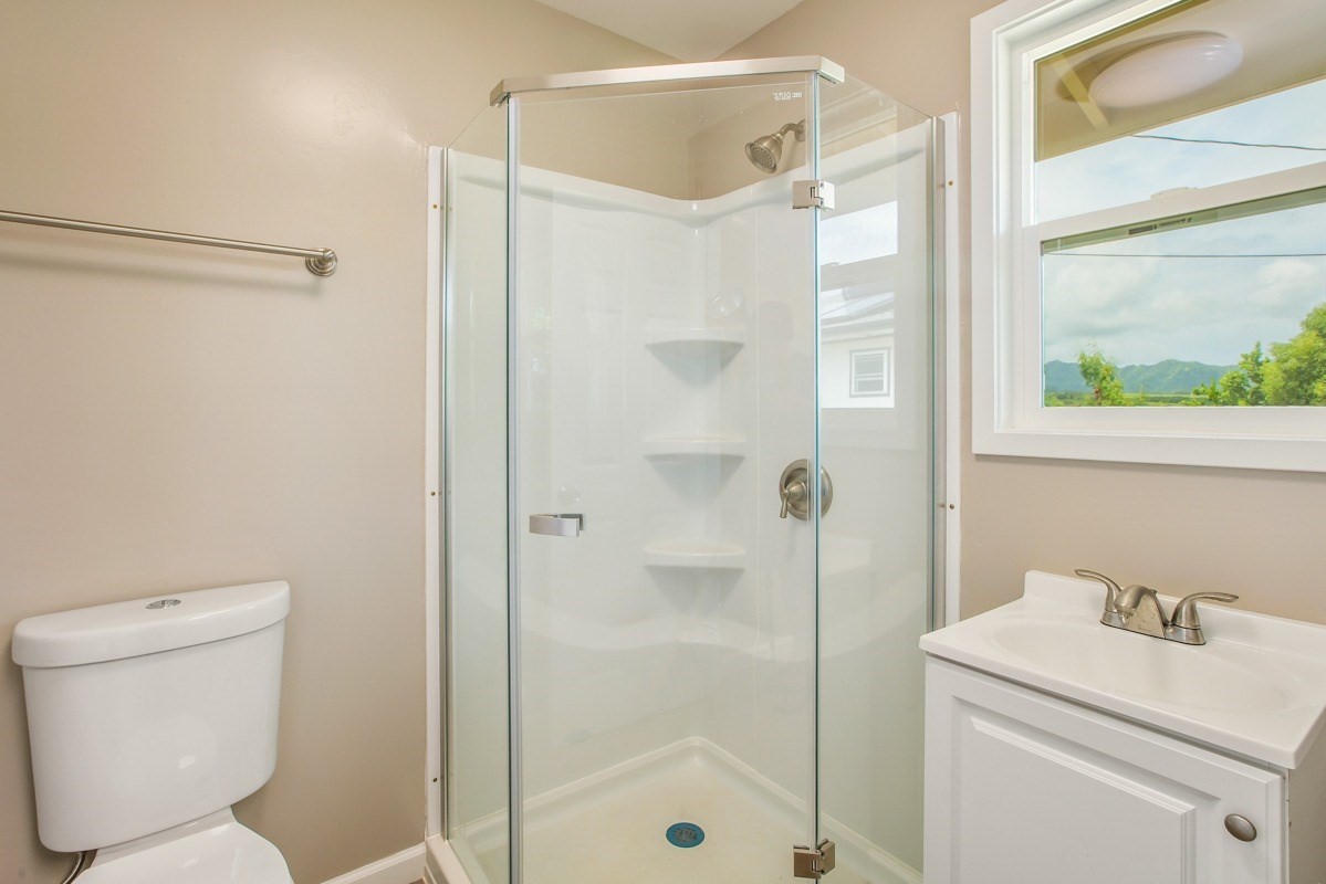 4722 Mailihuna Road Kapaa, HI 96746 - Photo 13 of 22 a bathroom with a shower a toilet and a sink