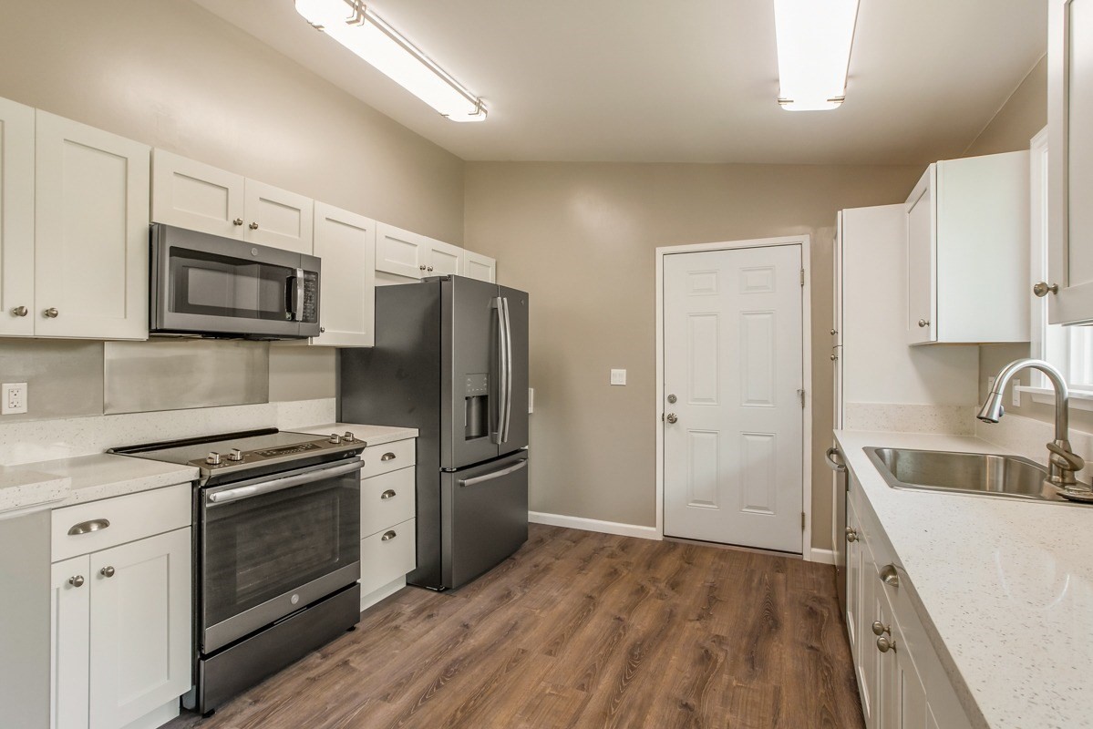 4722 Mailihuna Road Kapaa, HI 96746 - Photo 2 of 22 a kitchen with a sink stove and refrigerator