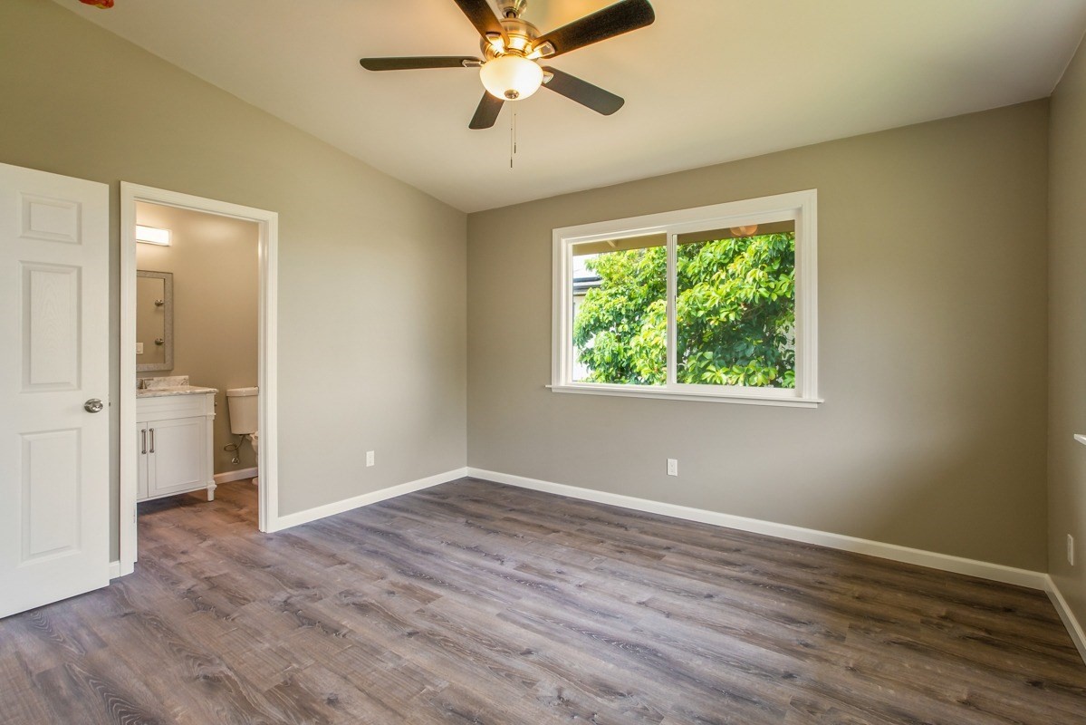 4722 Mailihuna Road Kapaa, HI 96746 - Photo 10 of 22 wooden floor in an empty room with a window