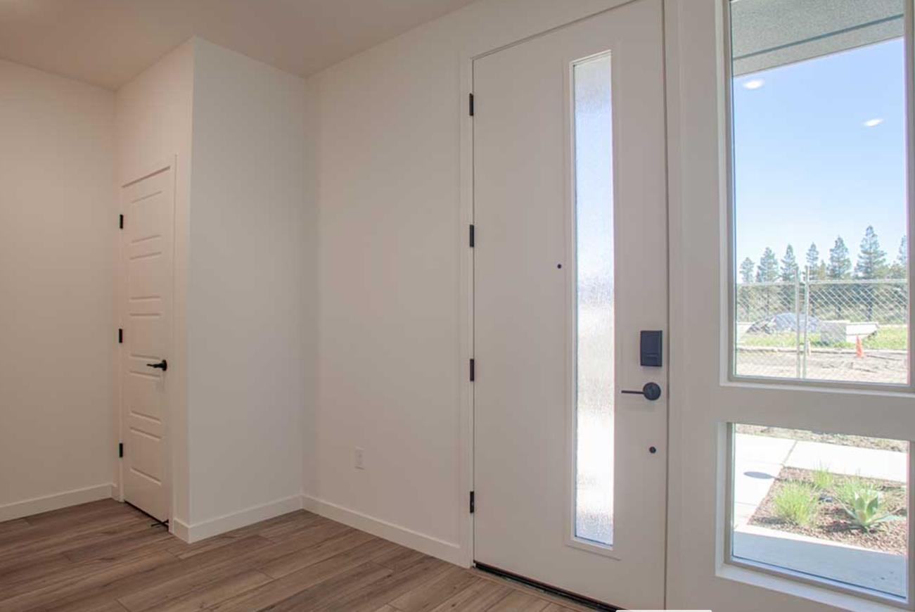 6701 Optimum Loop San Jose, CA 95119 - Photo 2 of 18 a view of an empty room with wooden floor and a window