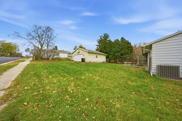 a view of a backyard with a garden and plants