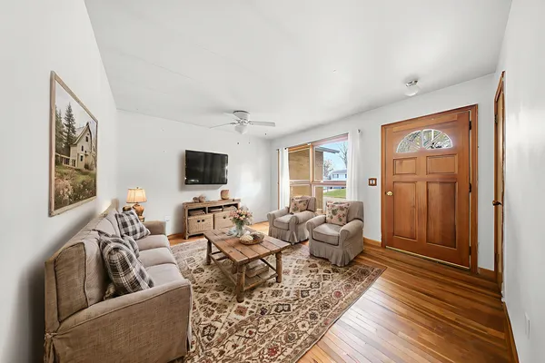 a living room with furniture and a flat screen tv