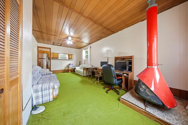 a room with furniture and a flat screen tv