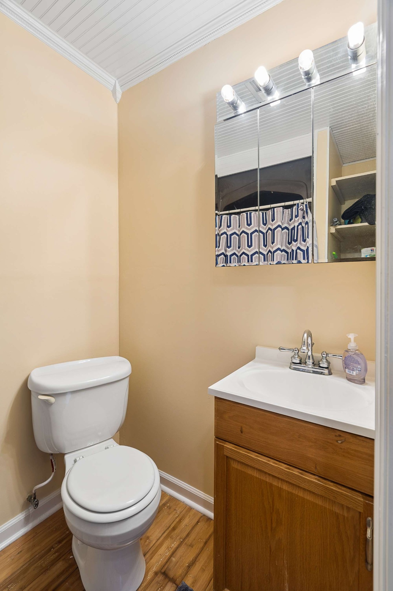 3332 Towne Village Road Antioch, TN 37013 - Photo 15 of 30 a bathroom with a sink a toilet and a mirror