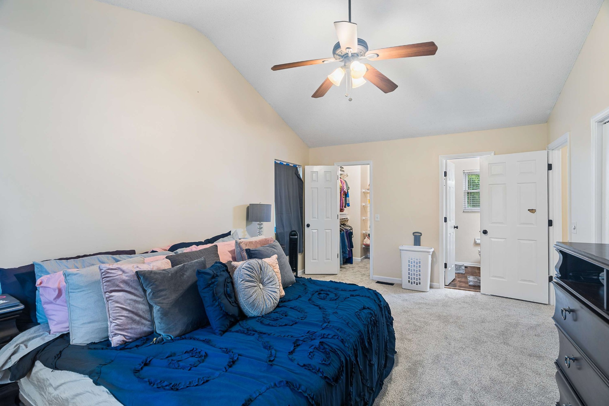 3332 Towne Village Road Antioch, TN 37013 - Photo 18 of 30 a spacious bedroom with a bed and a chandelier