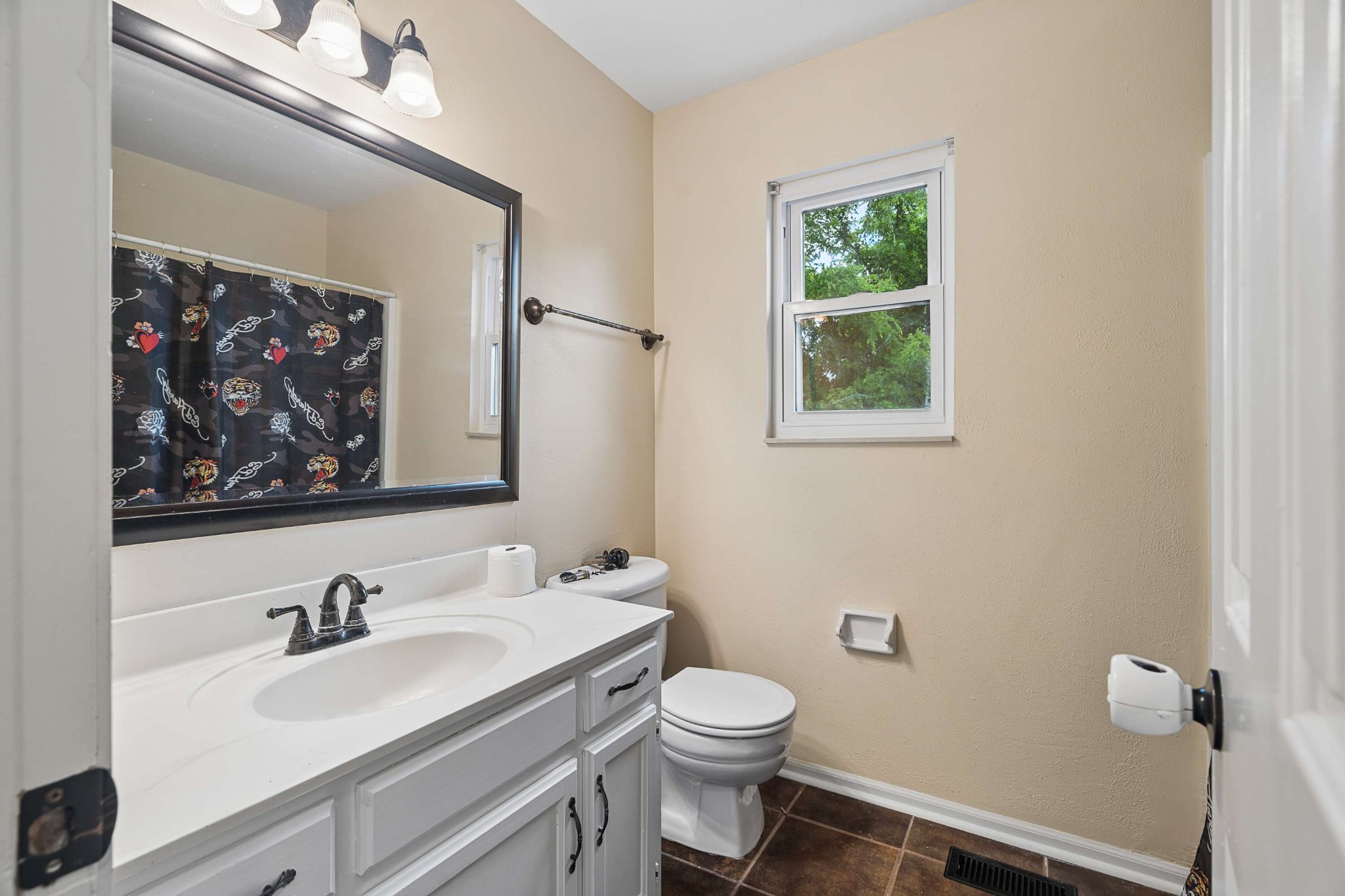 3332 Towne Village Road Antioch, TN 37013 - Photo 19 of 30 a bathroom with a granite countertop sink mirror vanity and toilet
