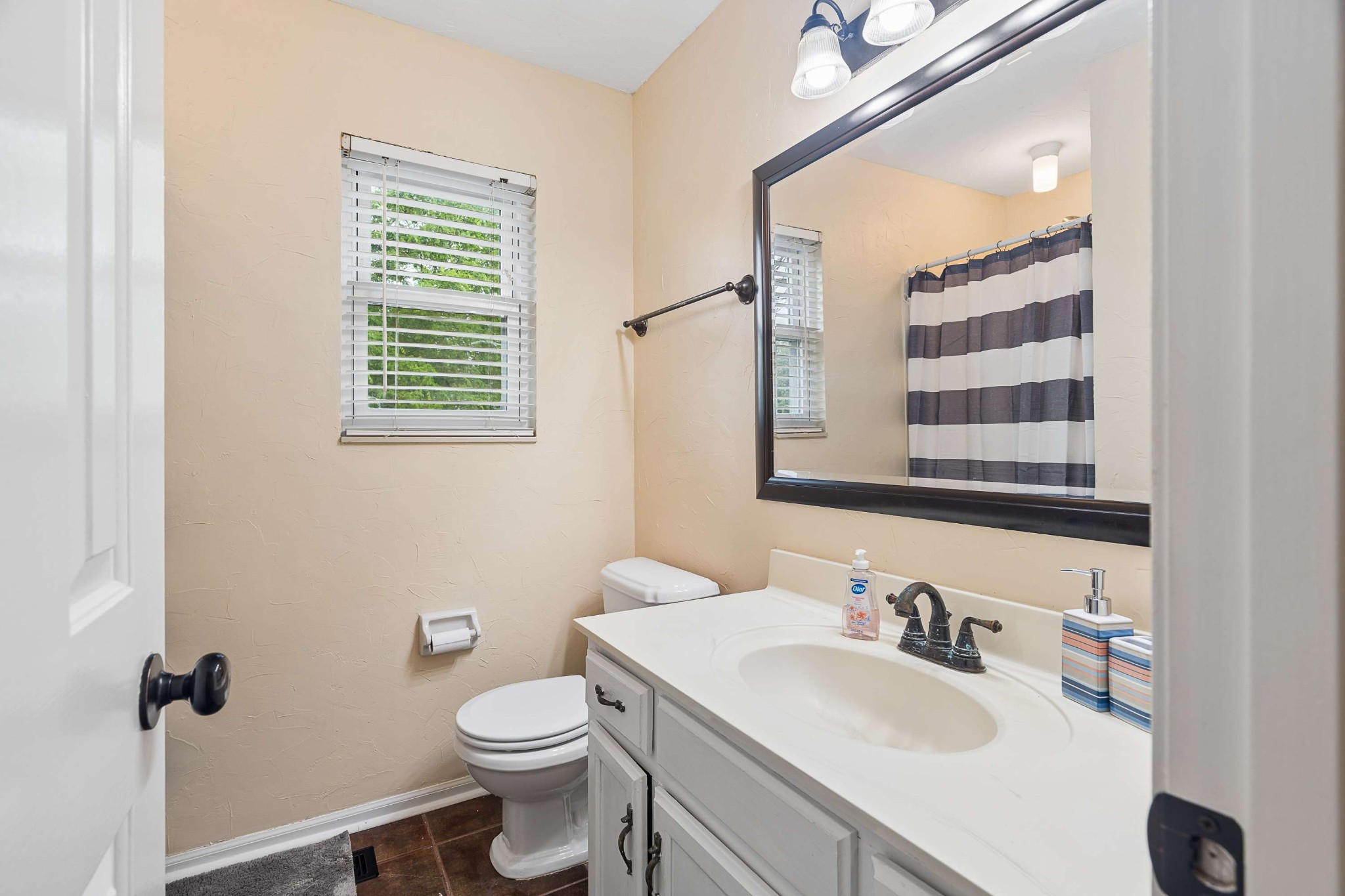 3332 Towne Village Road Antioch, TN 37013 - Photo 20 of 30 a bathroom with a granite countertop sink toilet and mirror