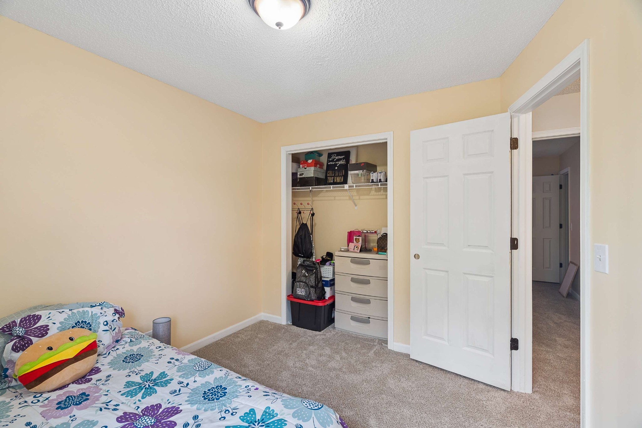 3332 Towne Village Road Antioch, TN 37013 - Photo 21 of 30 a bedroom with a bed and a dresser
