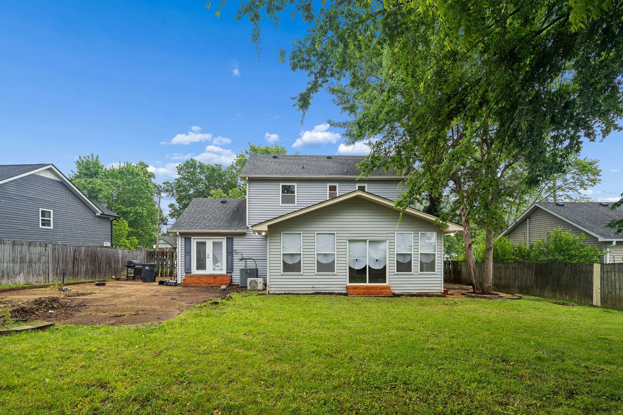 3332 Towne Village Road Antioch, TN 37013 - Photo 27 of 30 a front view of a house with a garden and trees