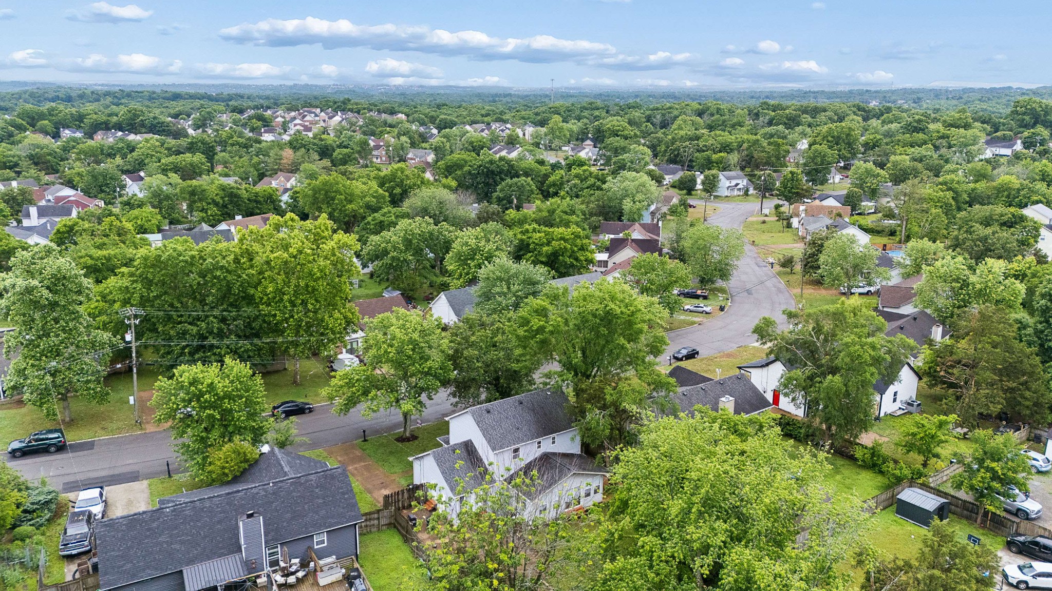 3332 Towne Village Road Antioch, TN 37013 - Photo 29 of 30 an aerial view of a city with lots of residential buildings green landscape and mountain view