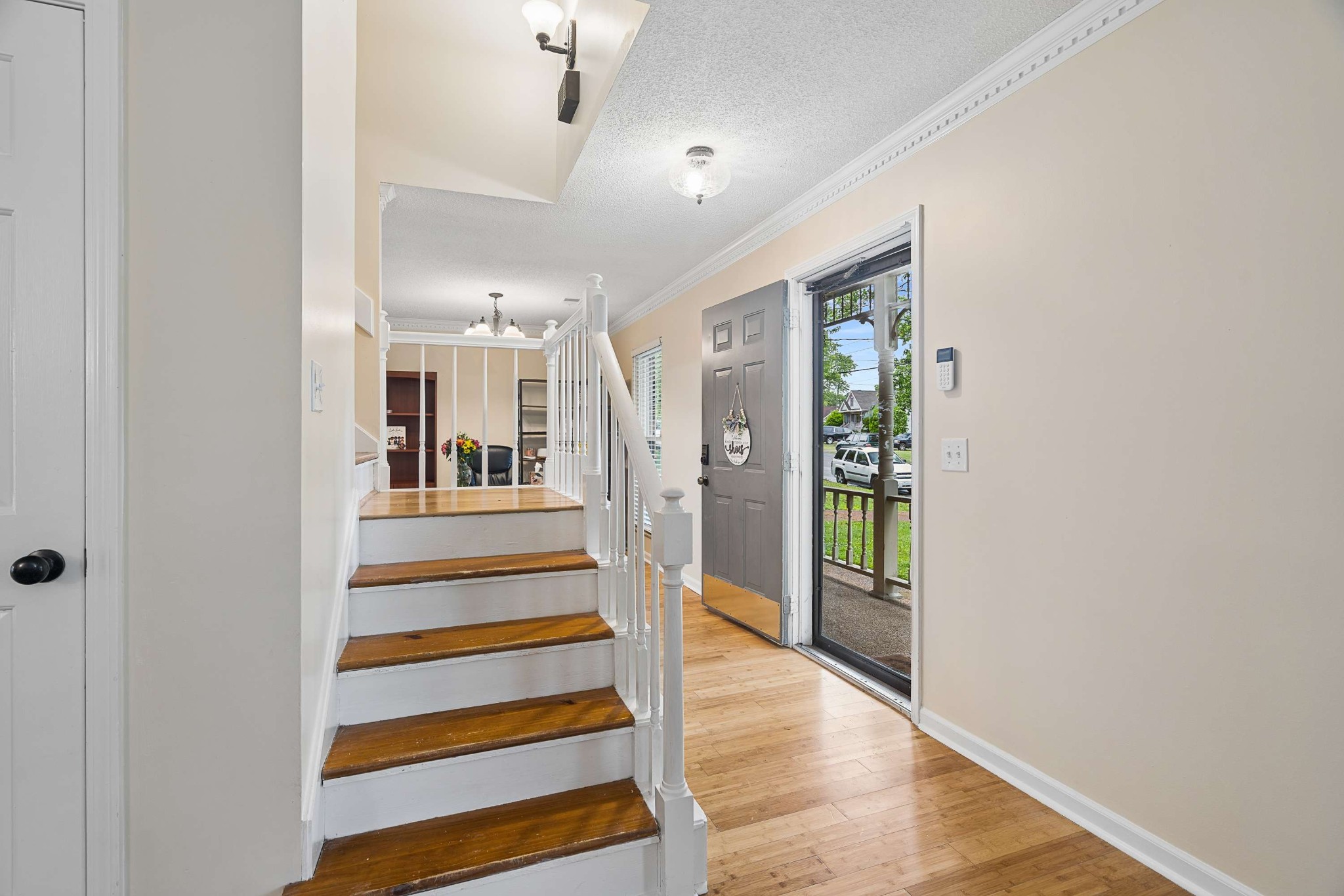 3332 Towne Village Road Antioch, TN 37013 - Photo 4 of 30 a view of a hallway with wooden floor and staircase